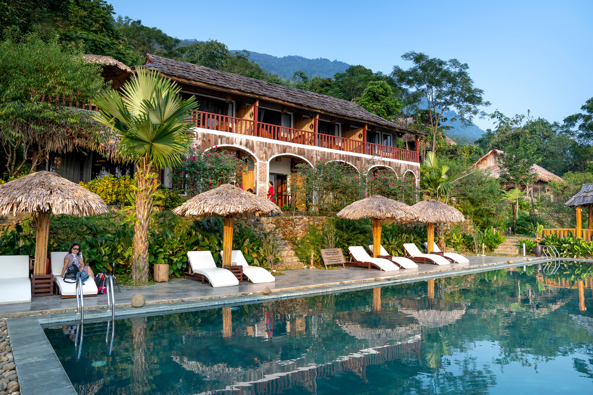 Small hotel with pool in tropical resort